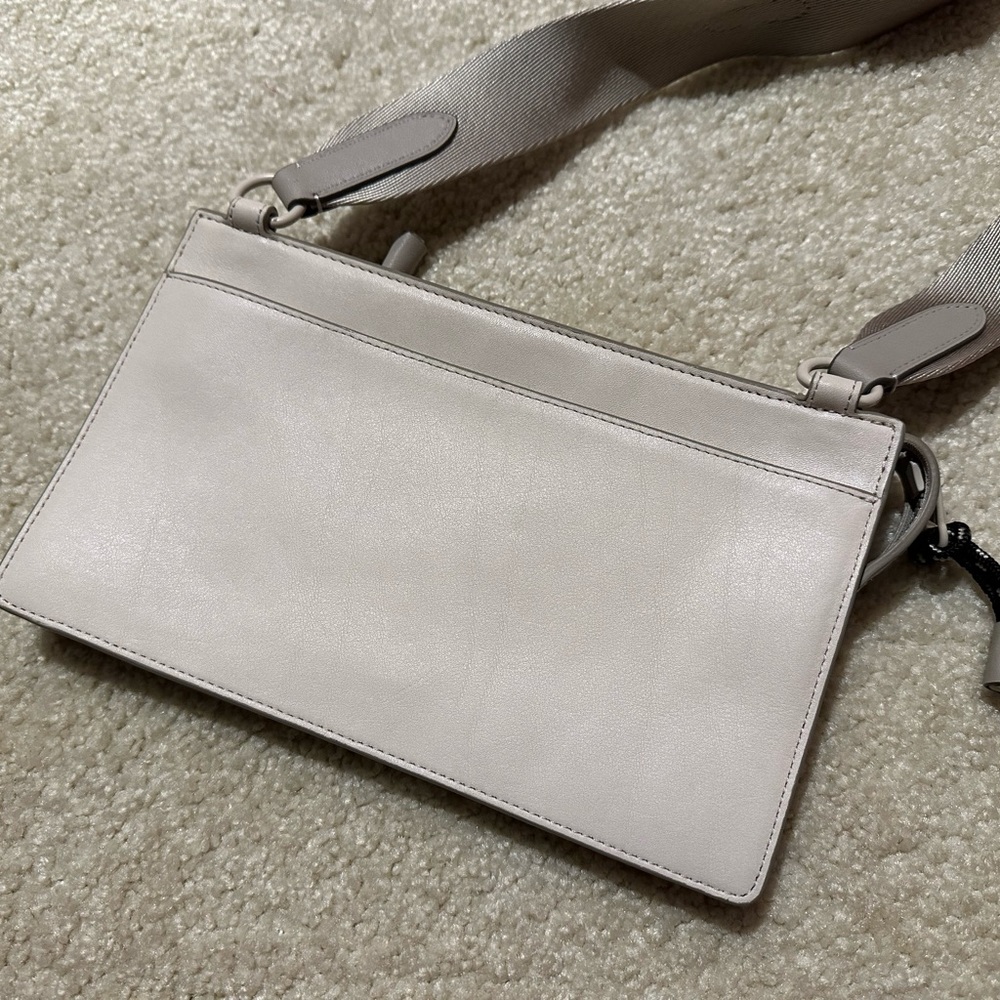 Coach Men’s Rivington Pouch 
Item # C0947
Original price $275
Color: Chalk/Bone - Picture 3 of 5